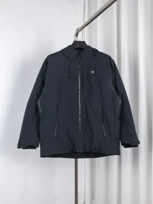 Black hooded jacket made of waterproof material with front zipper and pockets.