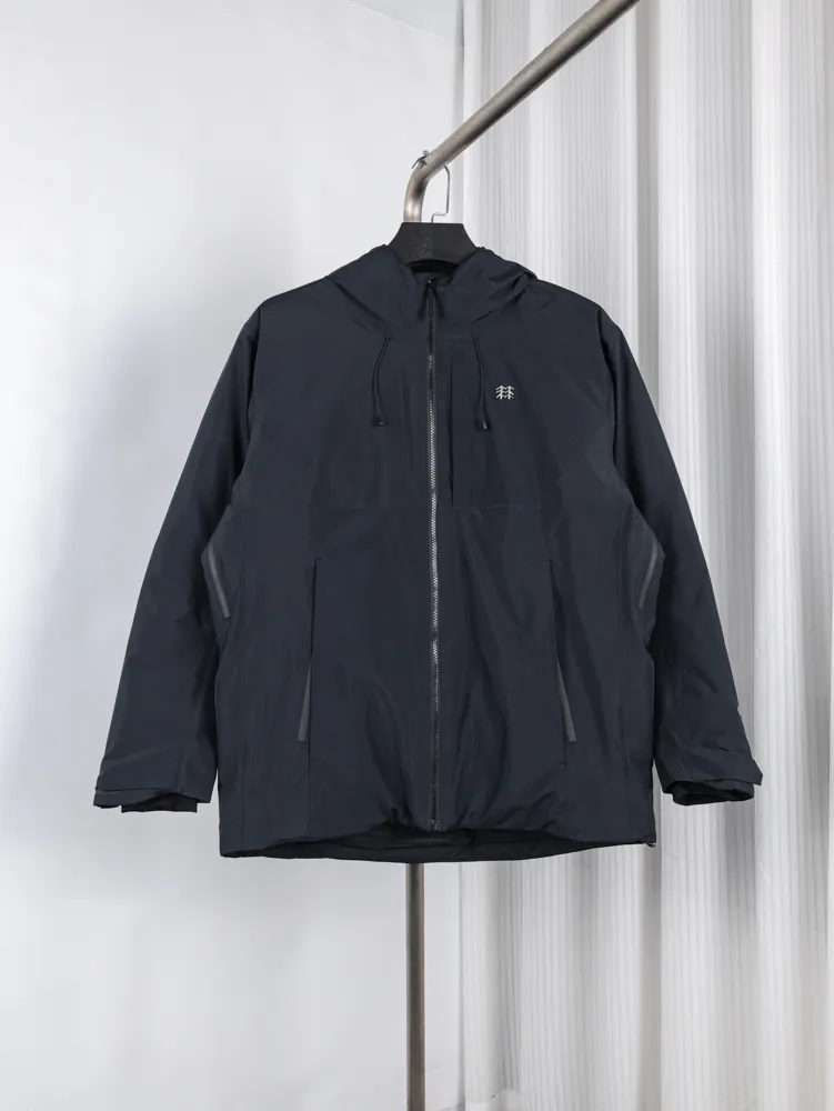 Black hooded jacket made of waterproof material with front zipper and pockets.