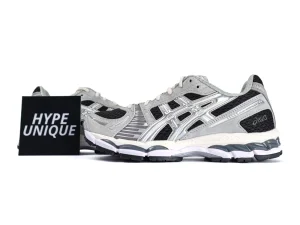 Gray and black mesh sneakers with white sole, featuring silver accents on sides.