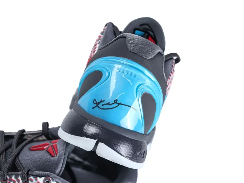 Black and blue sneaker with synthetic upper and signature detail on heel.