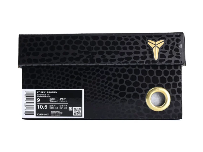Black textured shoe box with gold logo and metal-reinforced eyelet, size label visible.