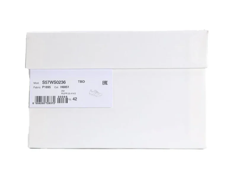 White cardboard shoe box with label displaying product details and barcode.