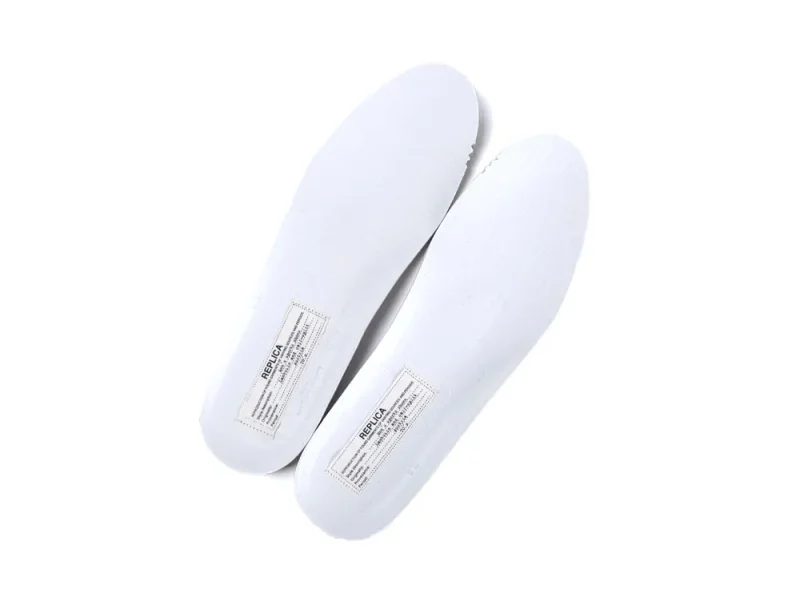 White rubber insoles with printed label, designed for comfortable shoe fitting.