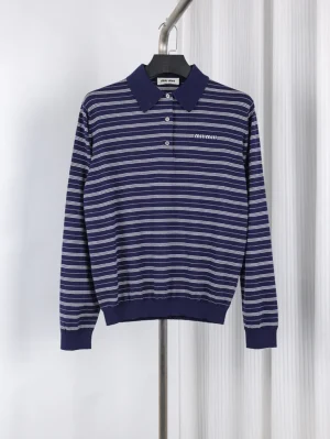 Navy striped cotton polo shirt with ribbed cuffs and collar detailing.