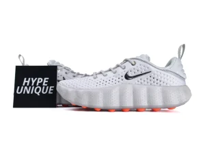 White sneakers with a perforated upper, rubber sole, and orange accents.