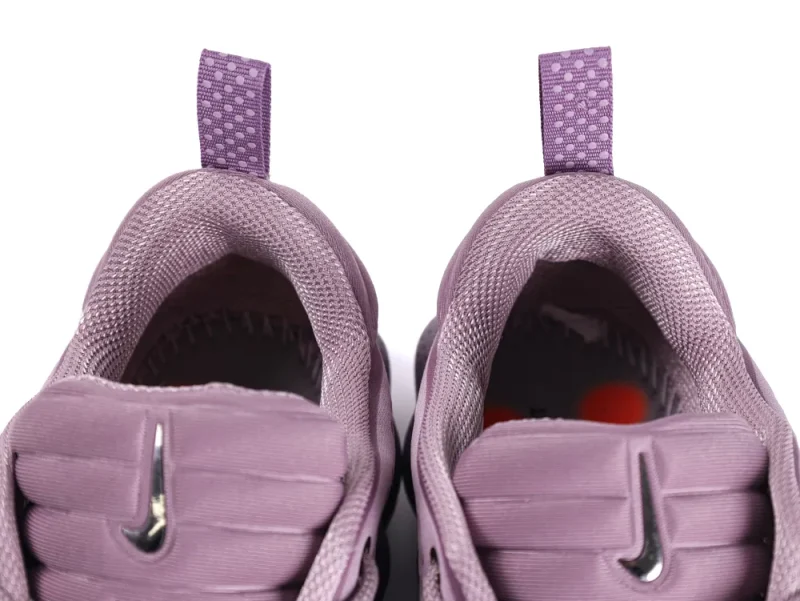 Purple mesh sneakers with a silver logo on the padded tongue and heel tab.