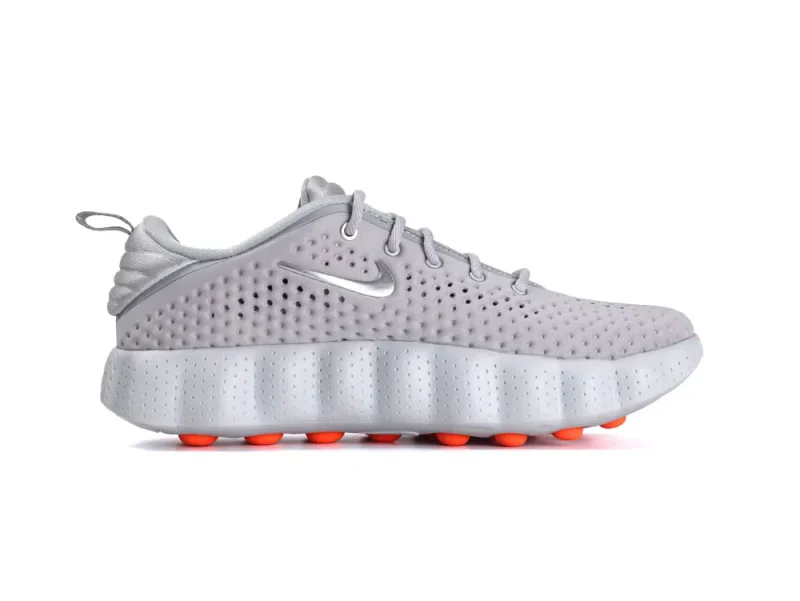 Gray mesh sneakers with perforated design, featuring vibrant orange accents on the sole.