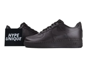 Dark brown leather sneakers with perforated toe box and textured outsole.