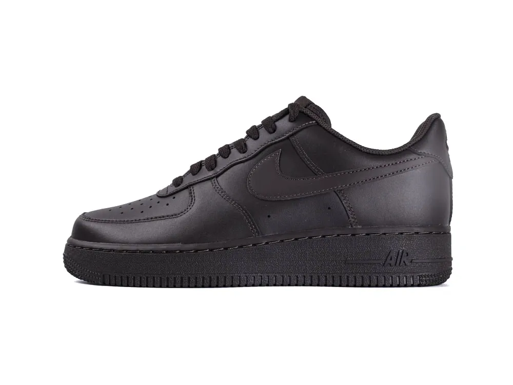 Black leather sneaker with perforated toe box and textured rubber sole.