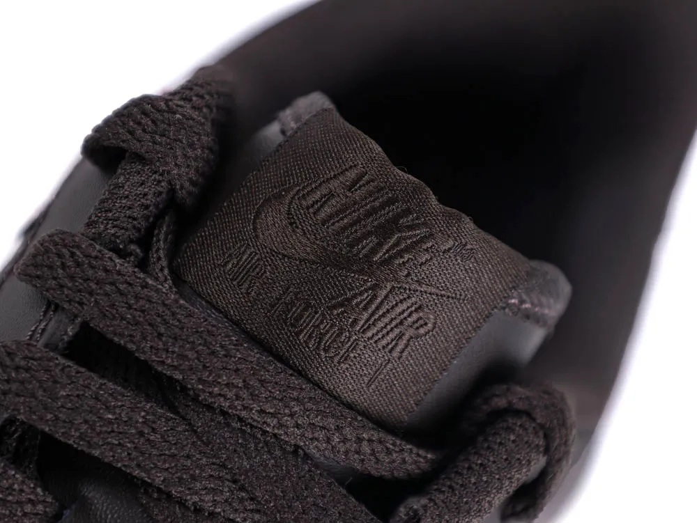 Close-up of dark brown fabric shoe tongue and matching laces.
