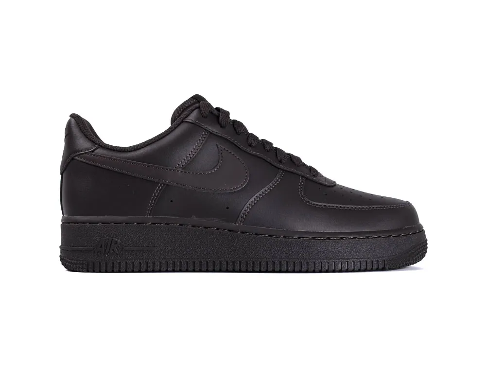 Black leather sneaker with stitched details and a rubber sole.