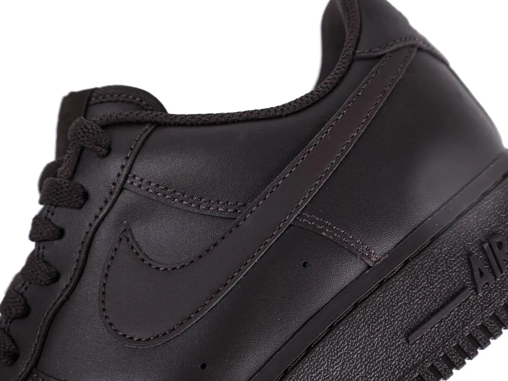 Dark brown leather sneaker with matching laces and distinctive sole design.
