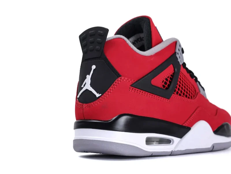 Red suede sneaker with black and gray accents, featuring a padded heel.
