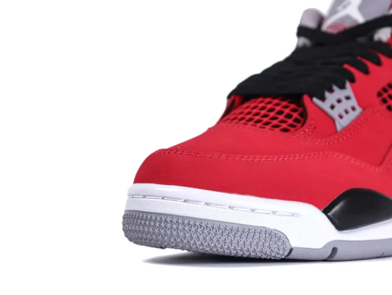 Red leather sneaker with black laces and gray textured rubber sole.