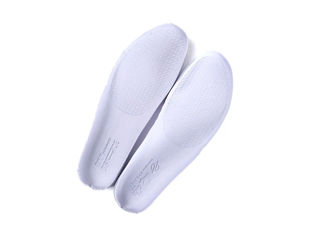 White synthetic shoe insoles with textured grip pattern, shown from above.
