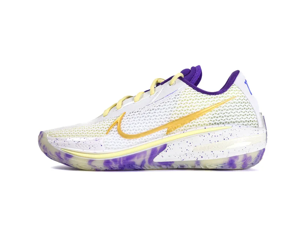 White mesh sneaker with purple and yellow accents, featuring a textured sole design.
