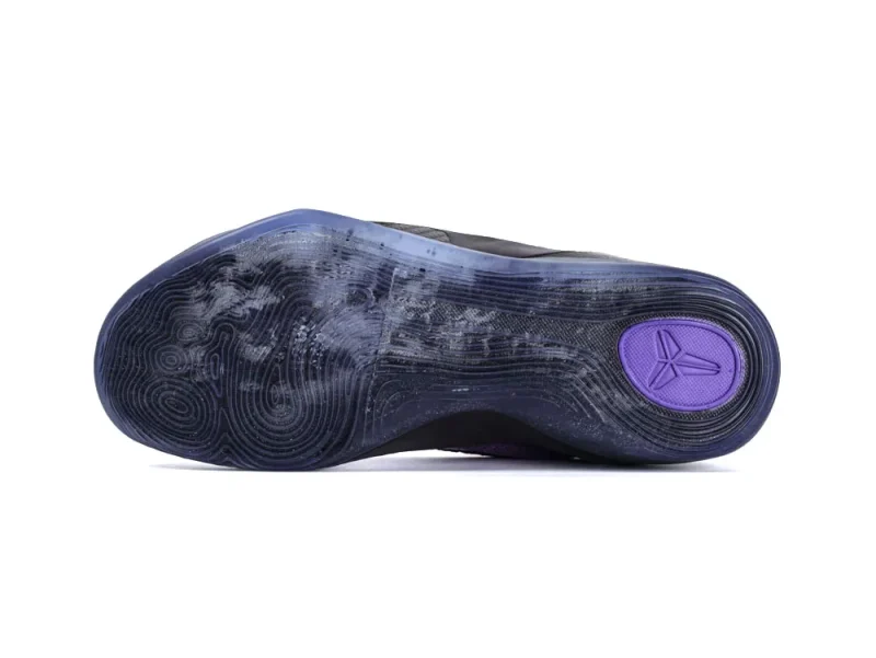 Translucent rubber sole with purple accents, featuring textured circular patterns underneath.