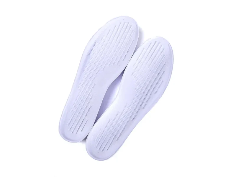 White foam shoe insoles with ribbed texture, designed for comfort and support.