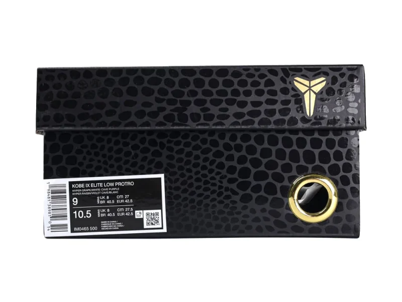 Black textured shoe box with gold accents and a circular metallic part.