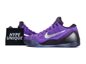 Purple mesh athletic shoe with silver logo, black textured heel, and rubber sole.