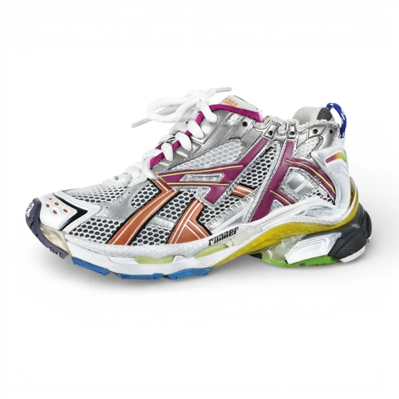 Multicolored sneaker with silver mesh, orange and pink accents, and white laces.