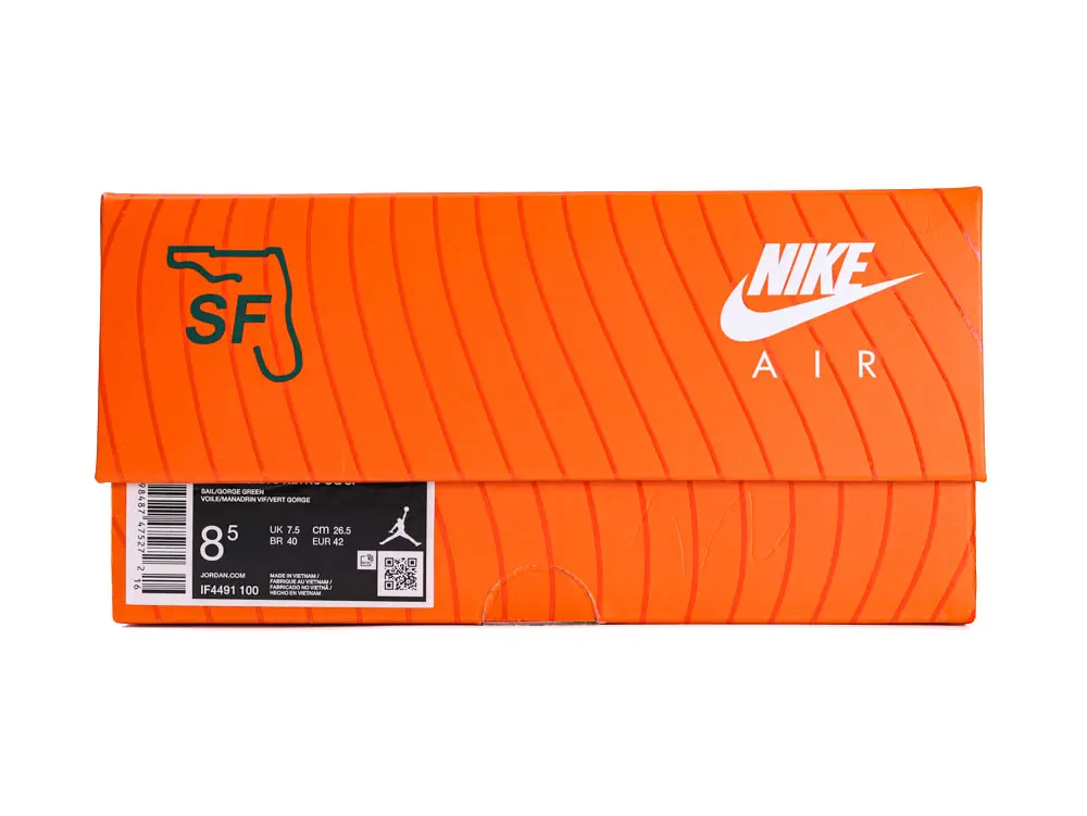 Bright orange cardboard Nike shoe box with distinct brand logo and design.