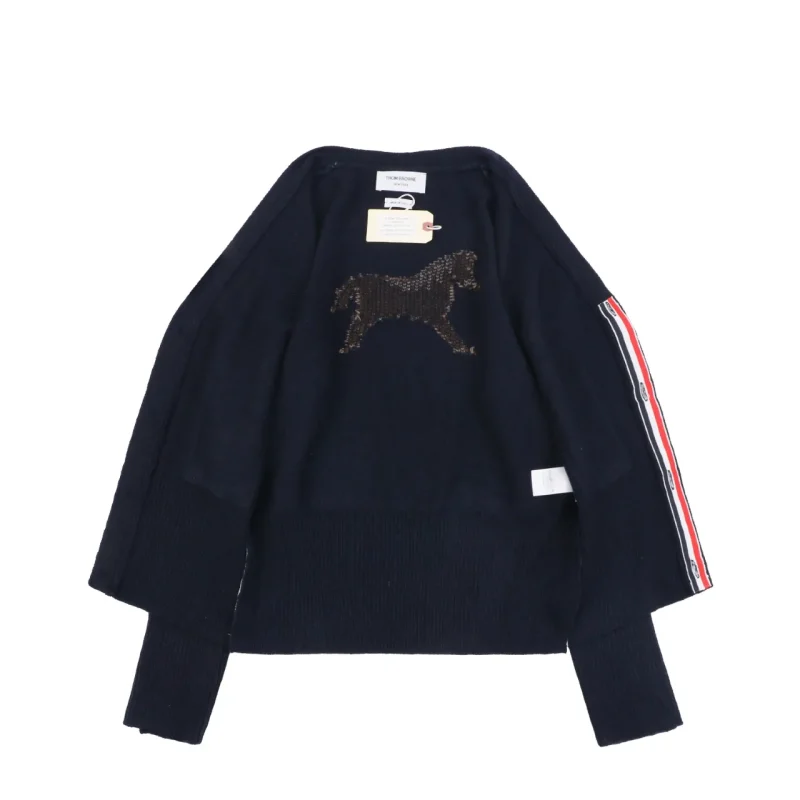 Back view of navy knit cardigan with horse graphic and stripe sleeve detail.