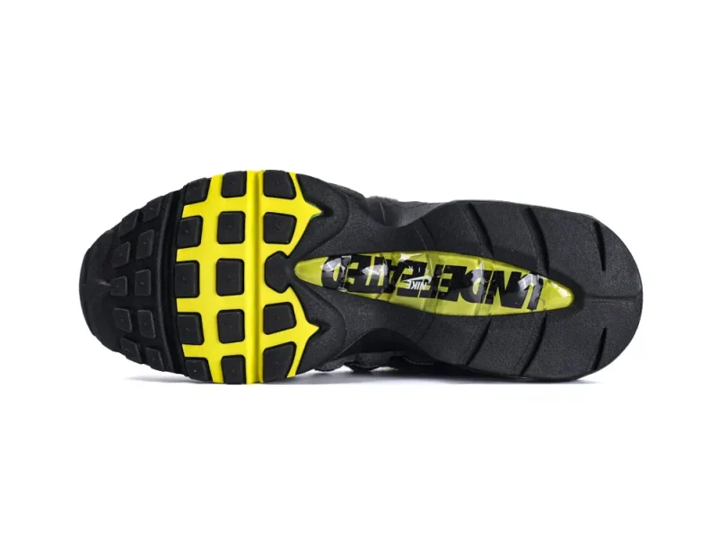 Black and yellow rubber sneaker sole with textured grip pattern.