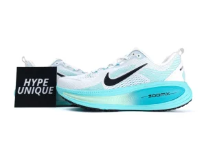 White and aqua mesh sneakers with black swoosh, turquoise ZoomX sole.