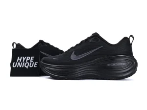 Black sneaker featuring a mesh upper and rubber sole, showcasing sleek design elements.