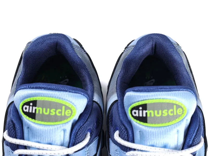 Blue mesh sneakers with dark trim and white laces, featuring green "aimmuscle" logo.