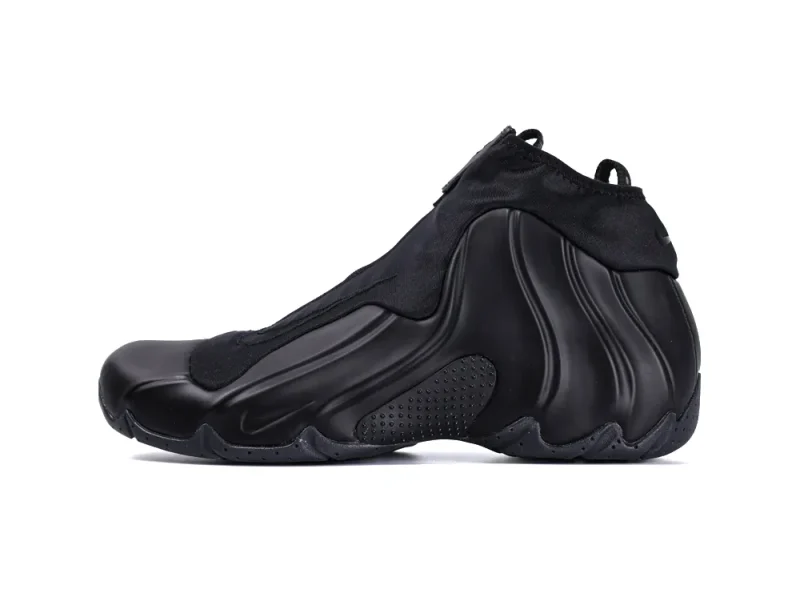 Sleek black sneaker with textured rubber sole and smooth synthetic upper.