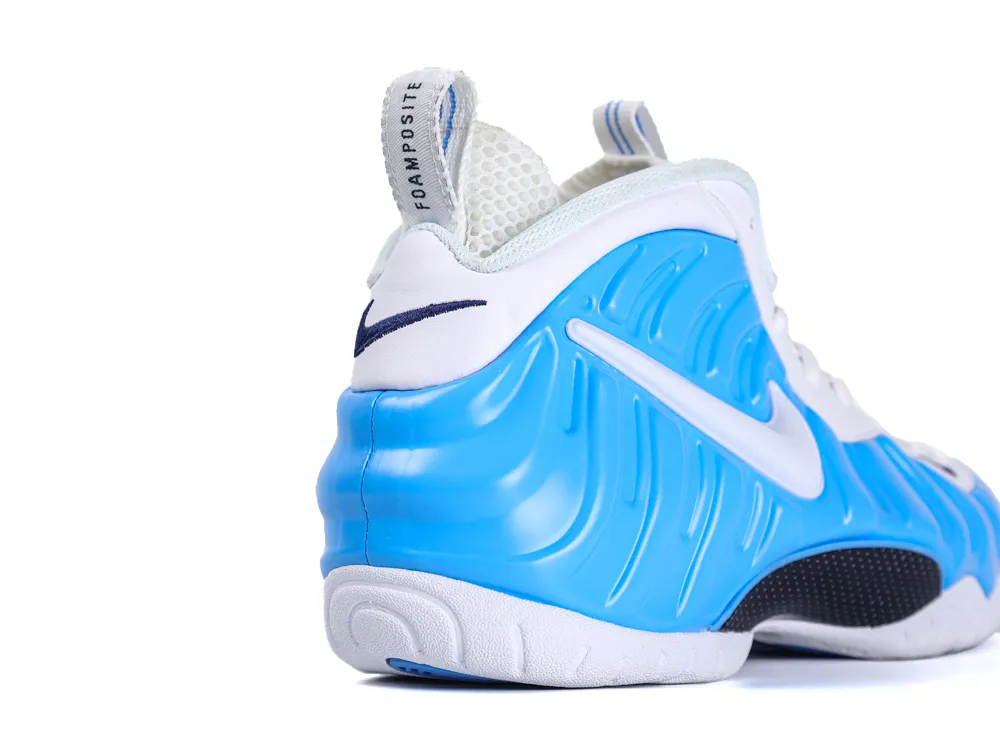 Blue foam and white fabric sneaker, featuring a swoosh logo on the side.