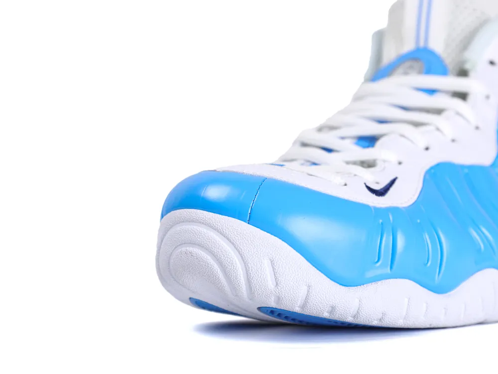 Blue and white sneaker with synthetic upper and textured sole in close-up view.