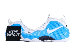 Blue and white sneakers with a glossy synthetic shell and mesh tongue panels.