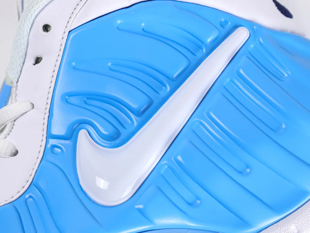 Blue foam sneaker heel with white mesh and logo detailing.