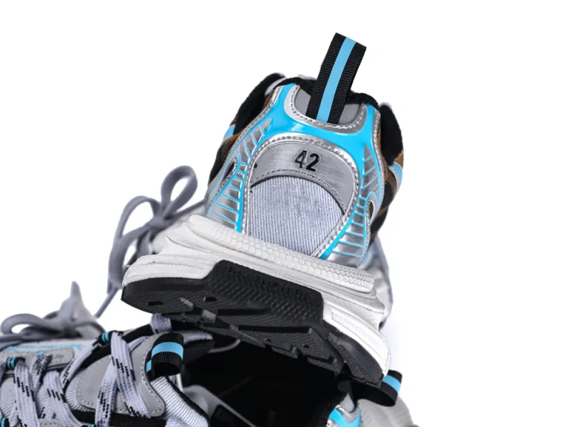 Gray and blue synthetic sneaker heels with black rubber soles, size 42 visible.