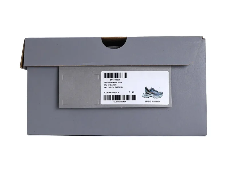 Gray cardboard shoe box with product label featuring blue and brown sneakers.