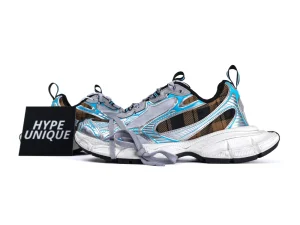 Colorful sneakers with blue and silver accents, plaid design, and textured white soles.