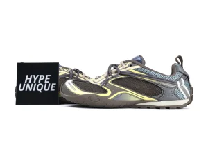 Multicolored sneakers with mesh and leather materials, featuring intricate panel designs.