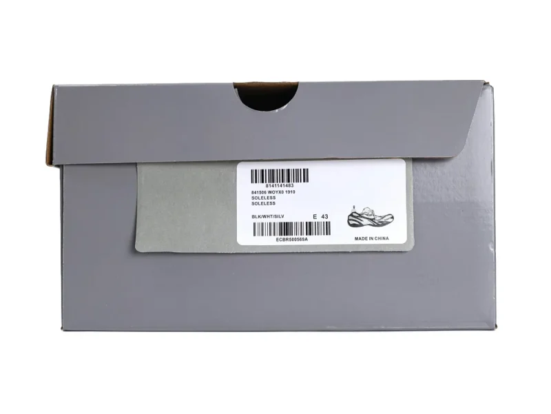 A grey cardboard shoe box with product label, displaying size and origin.