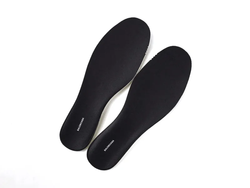 Black fabric shoe insoles, featuring a sleek and minimalist design.