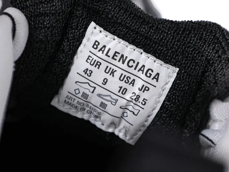 Label inside a black fabric shoe with size information and brand name.