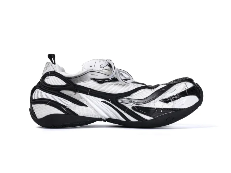 Black and white sneaker with a unique layered design and mixed materials.
