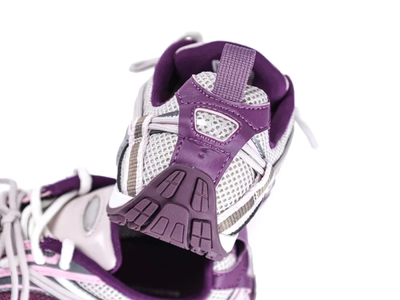 Purple and gray mesh sneakers with rubber sole and textile upper material.