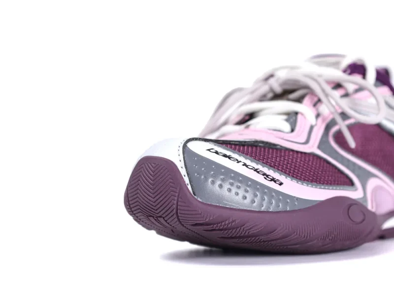 Purple and pink mesh sneaker with white laces and textured rubber sole.
