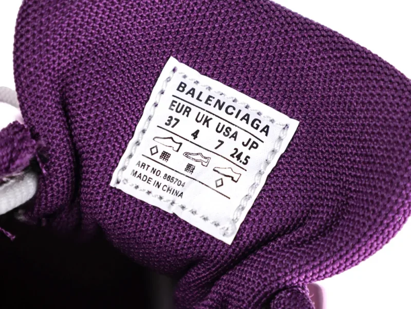 Purple fabric shoe tongue with white label displaying size and brand information.