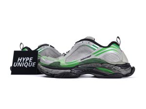 Gray and green sneakers featuring mesh material and detailed textured soles.