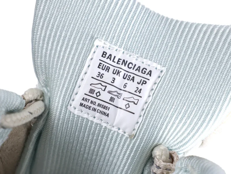 Light blue fabric with a white label inside part of a shoe.