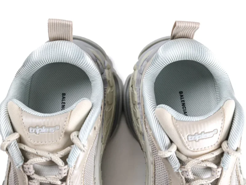 Gray and beige sneakers with fabric lining, rubber sole, and mesh upper. Top view.